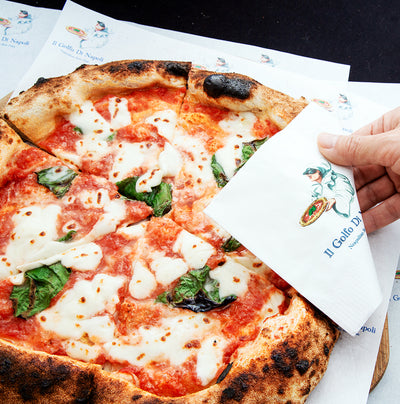Pizza served on custom printed food wrap paper
